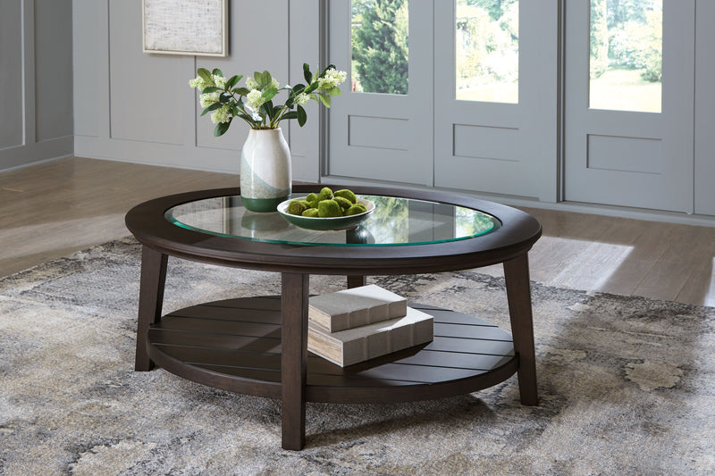 Celamar - Dark Brown - Oval Cocktail Table.