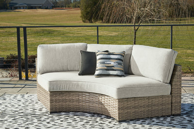 Calworth - Beige - Curved Loveseat With Cushion.