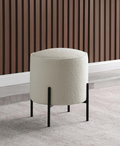 Basye - Round Upholstered Ottoman - Beige and Matte Black.