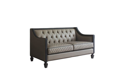 House - Beatrice Loveseat - Tan PU, Black PU & Charcoal Finish - Grand Furniture GA