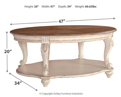 Realyn - White / Brown - Oval Cocktail Table.