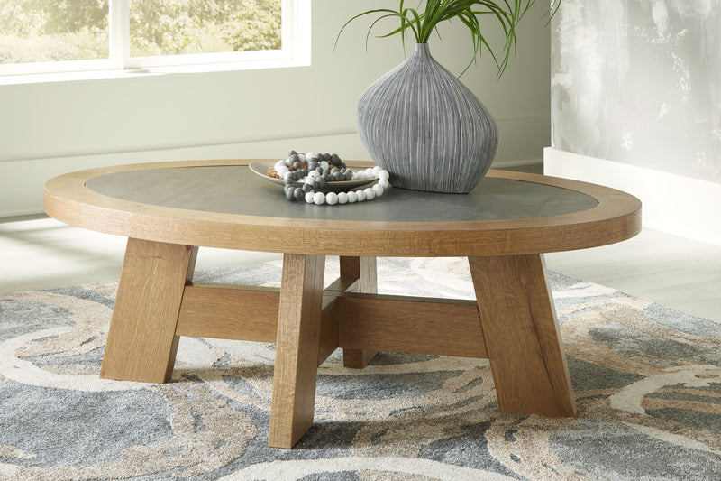 Brinstead - Light Brown - Oval Cocktail Table.